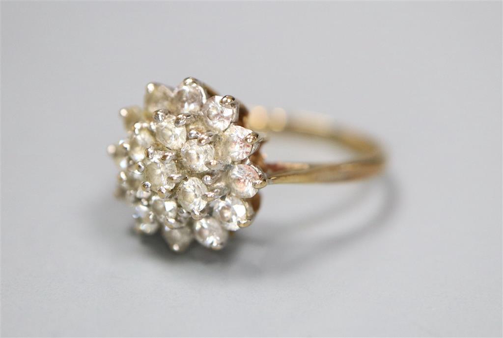 A modern 9ct gold and cubic zirconia cluster set dress ring, size J, gross 2.3 grams.